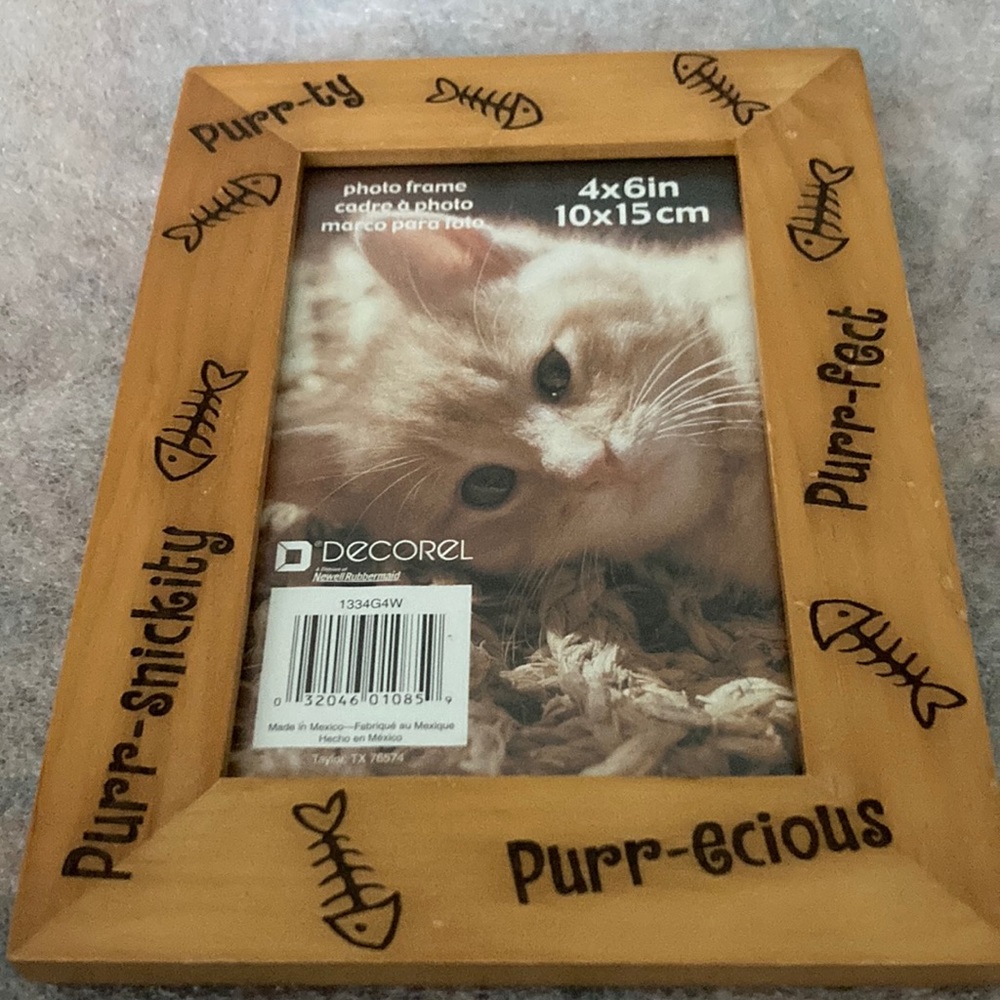 Photo frame holds 4 by 6 inch photo